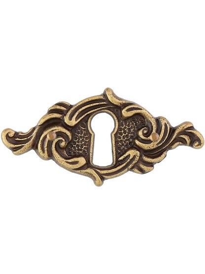 Swirl Design Keyhole Cover in Antique Brass Dark.